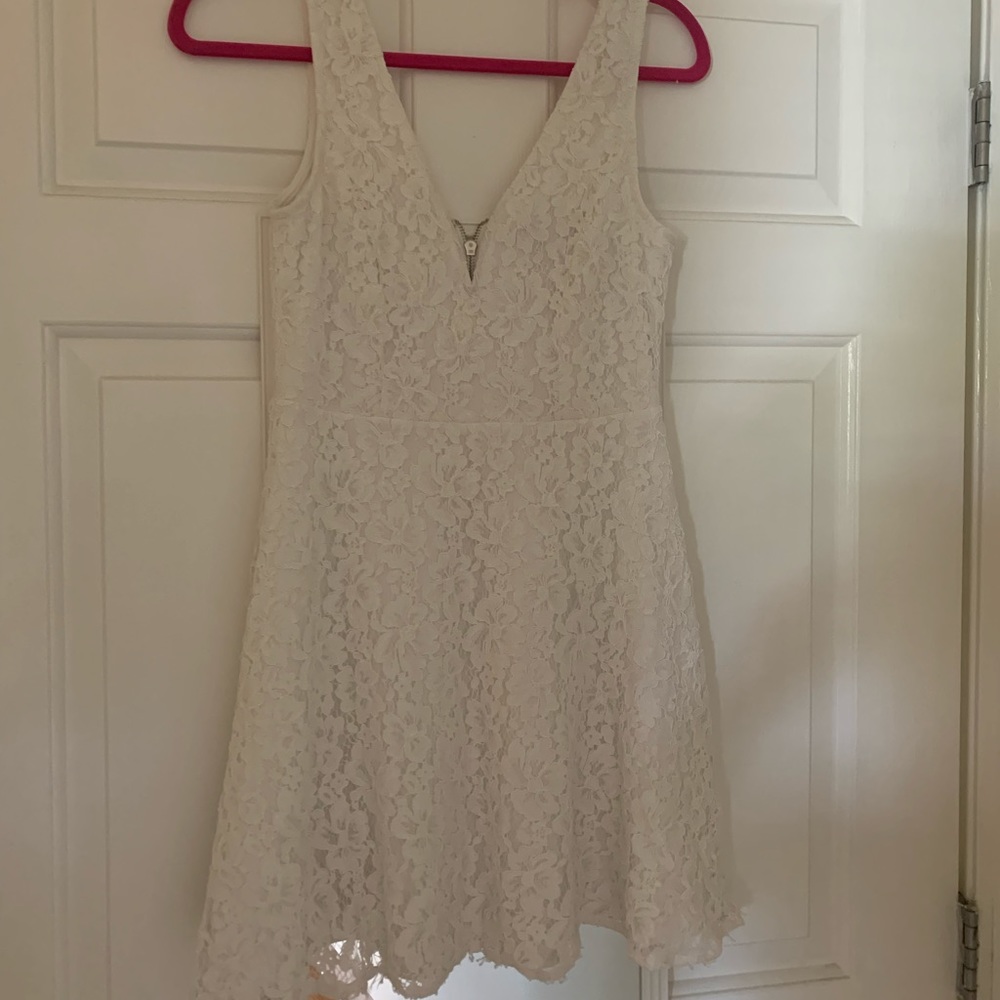 White dress worn once for rehearsal dinner. In great condition
